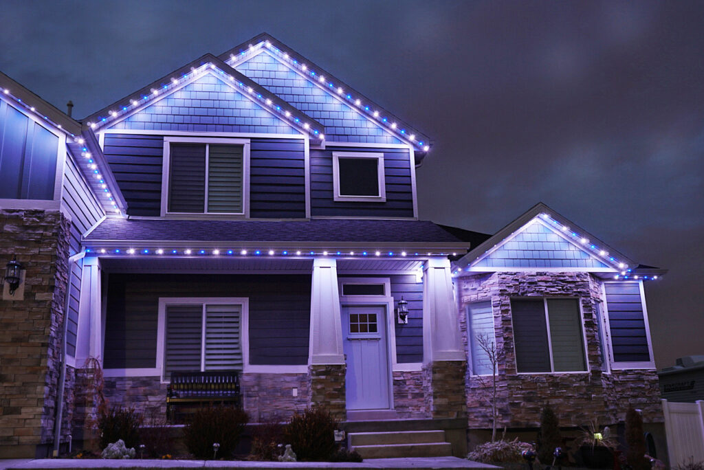 Blue and White lights on house created by Jellyfish Outdoor Lighting System