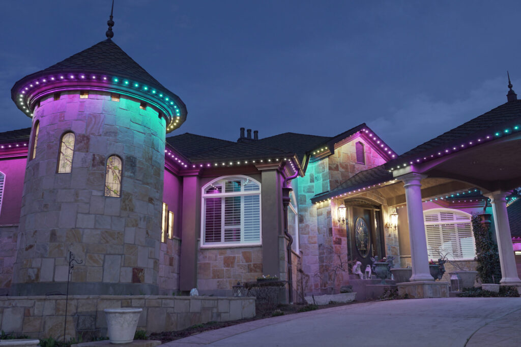 Rainbow colored lights on house with Jellyfish Outdoor Lighting System