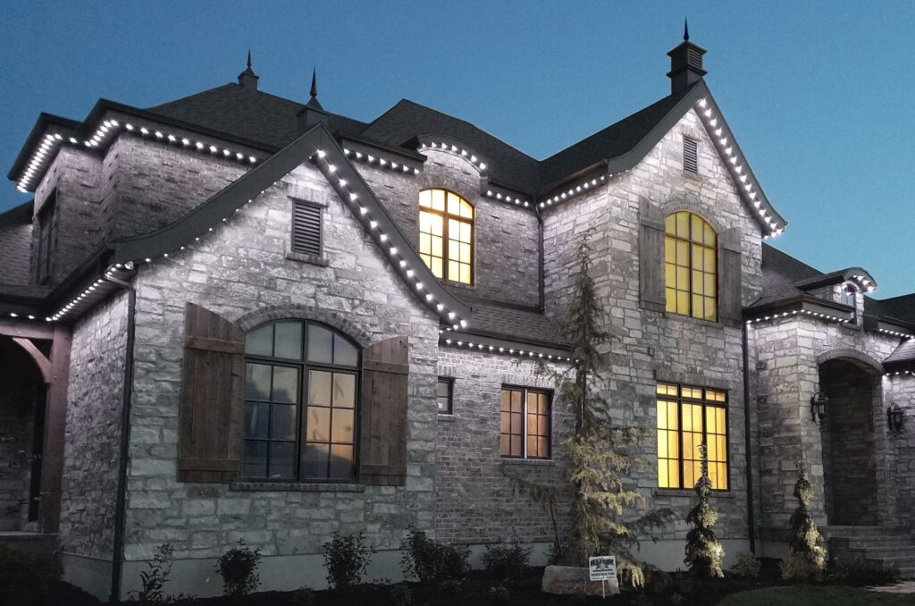 Castle looking house with white Jellyfish Outdoor Lighting System